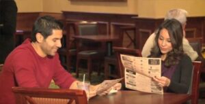 Two people reading Coffee News®